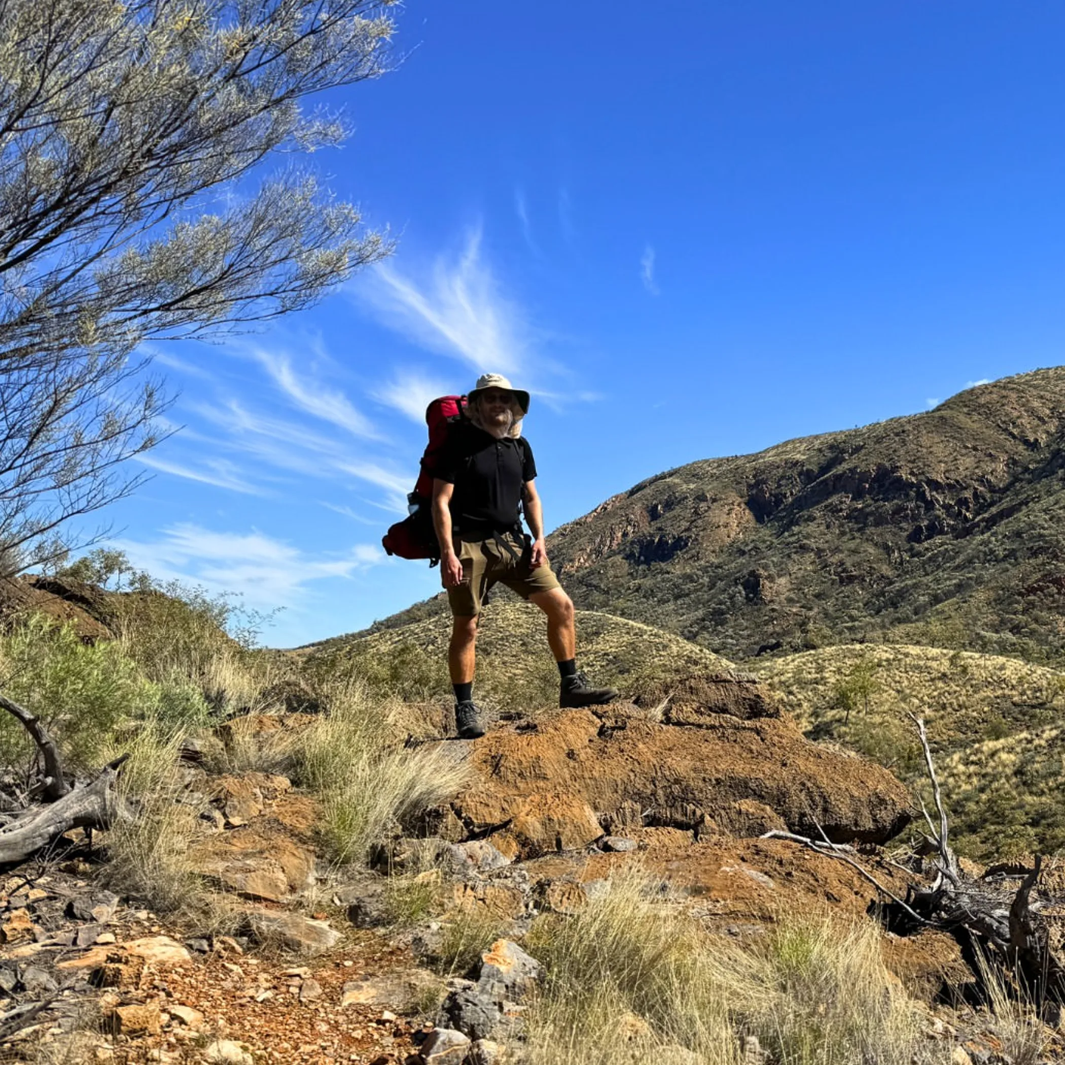 hiker in rugged desert terrain
