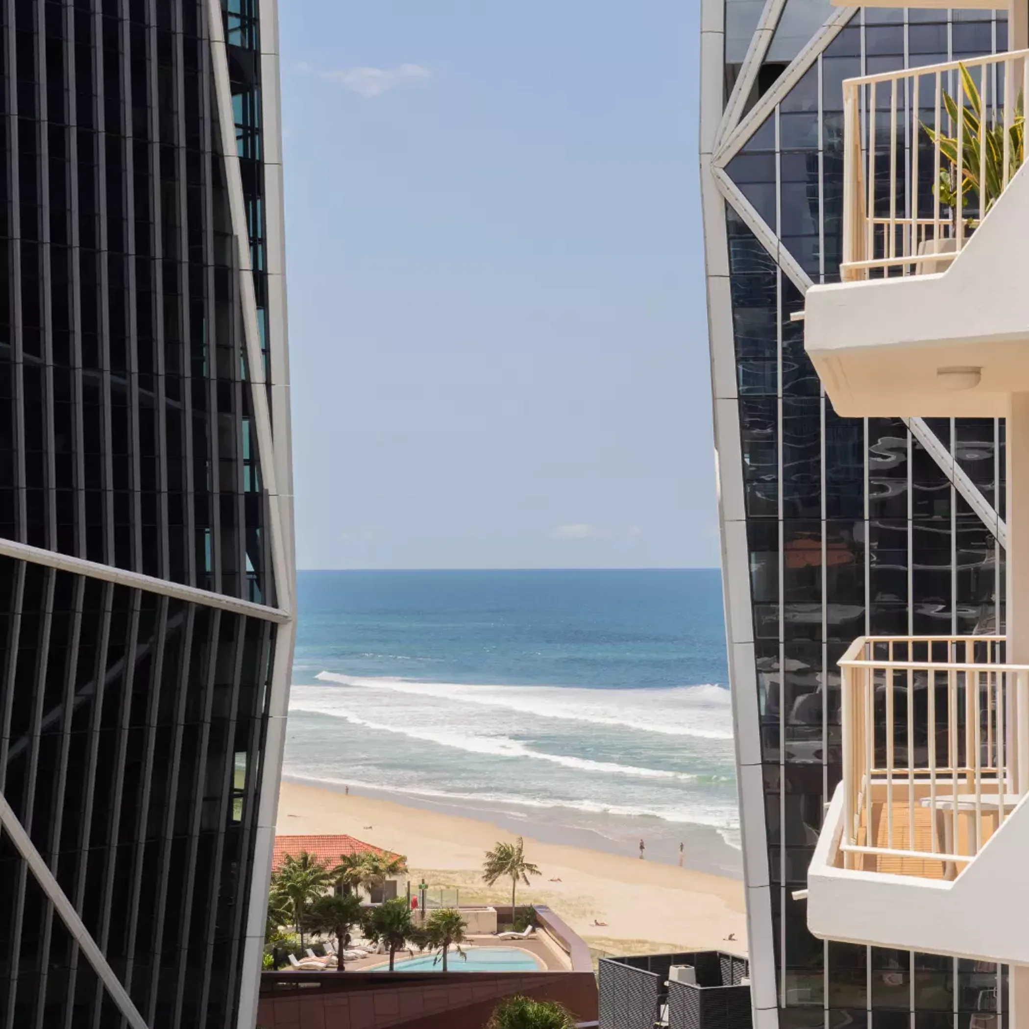 sunny beach with beachfront buildings